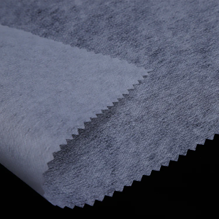 Attractive design nonwoven fusible interlining made of fabric, ideal for enhancing garment structure and providing a smooth finish.