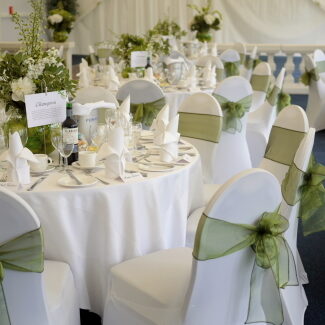 Elegant chair and table covers for weddings and events, providing a soft and sophisticated look.