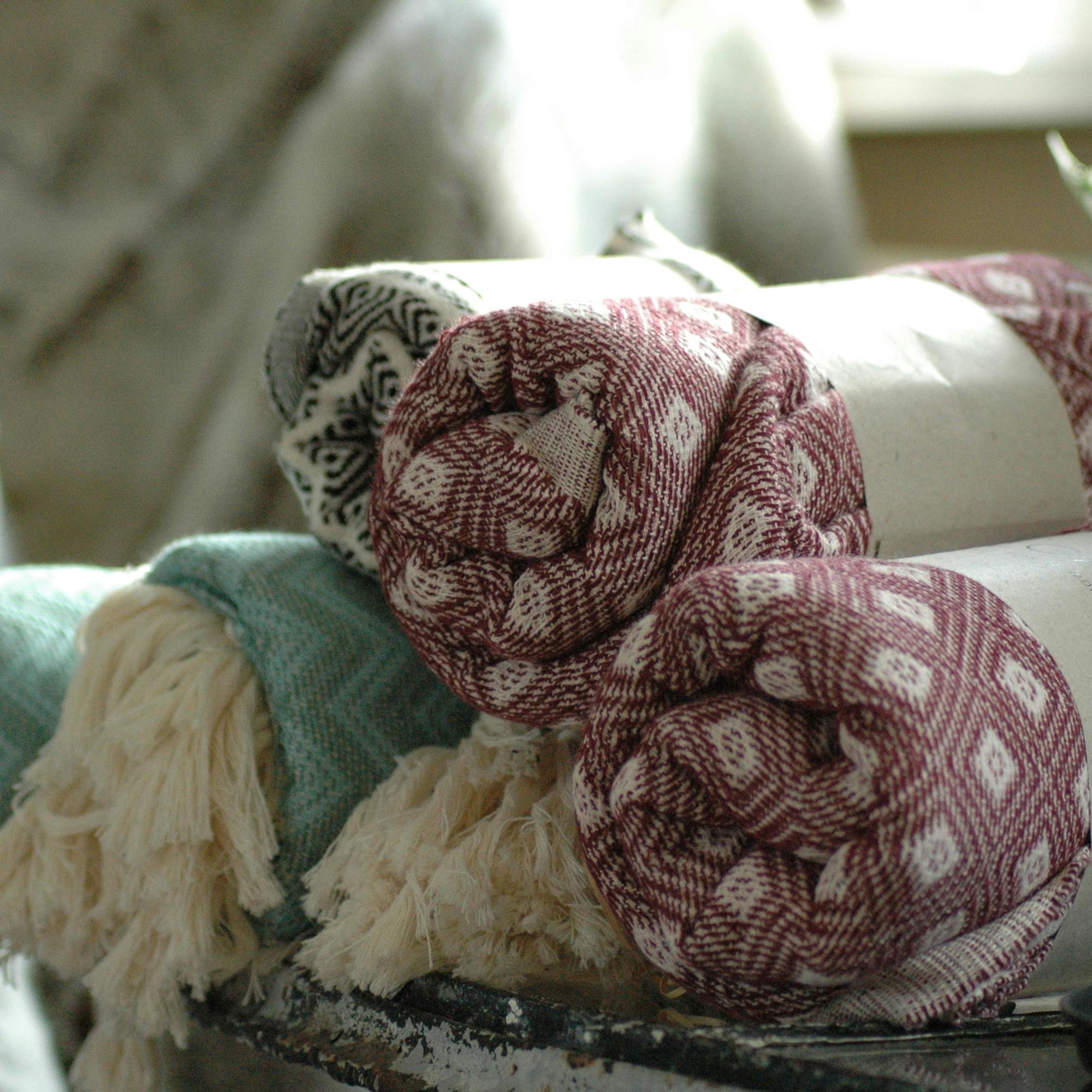 A soft, lightweight mat designed for versatile use in various settings such as play areas, yoga sessions, or as a decorative home accessory. The fabric features a natural texture and is available in neutral colors.